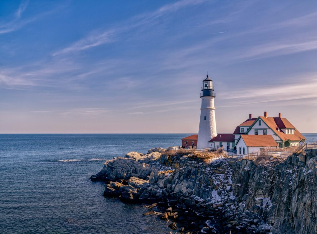 a lighthouse on a cliff by the sea, unique accommodation display